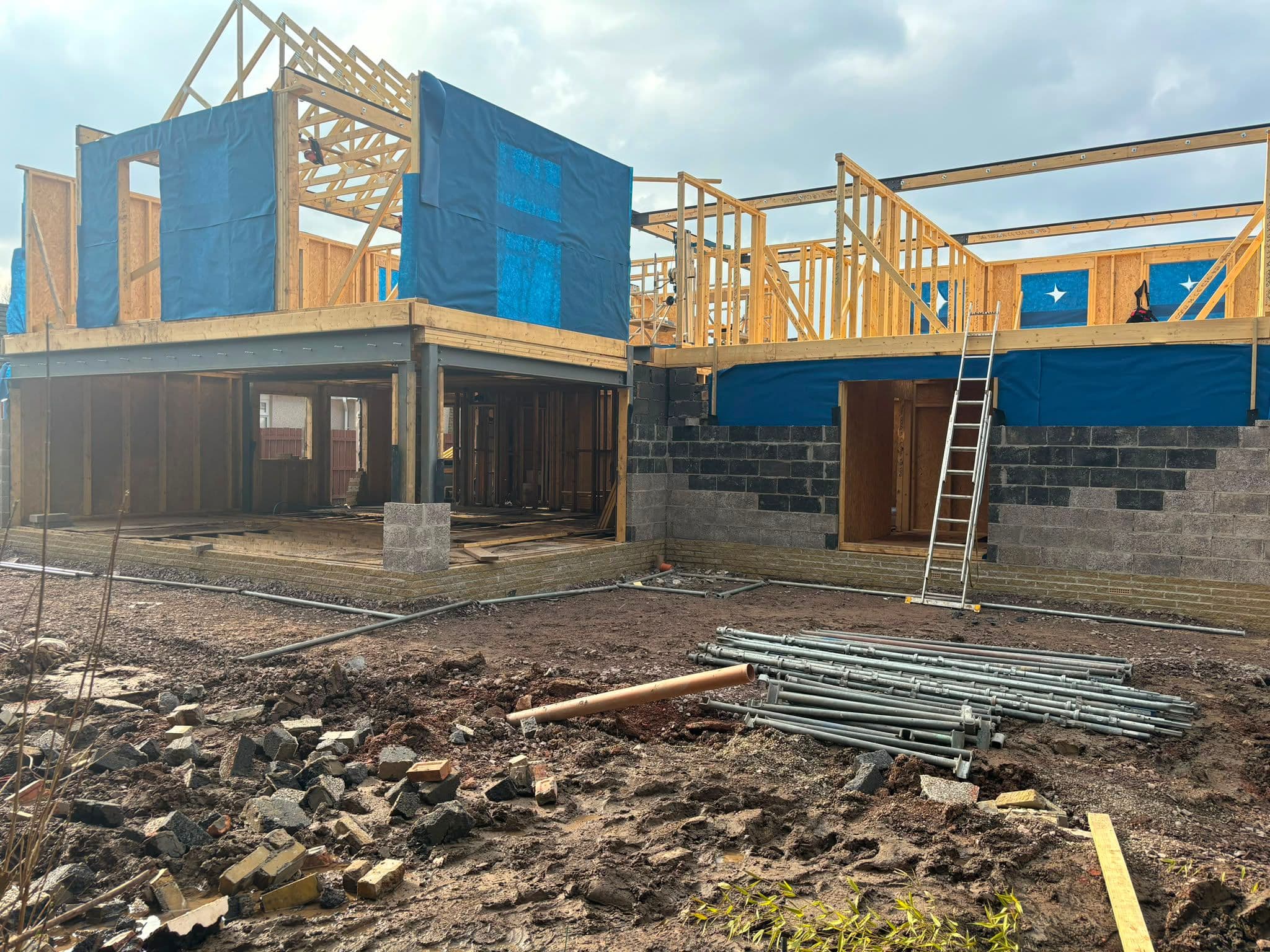 Two-storey timber frame extension under construction