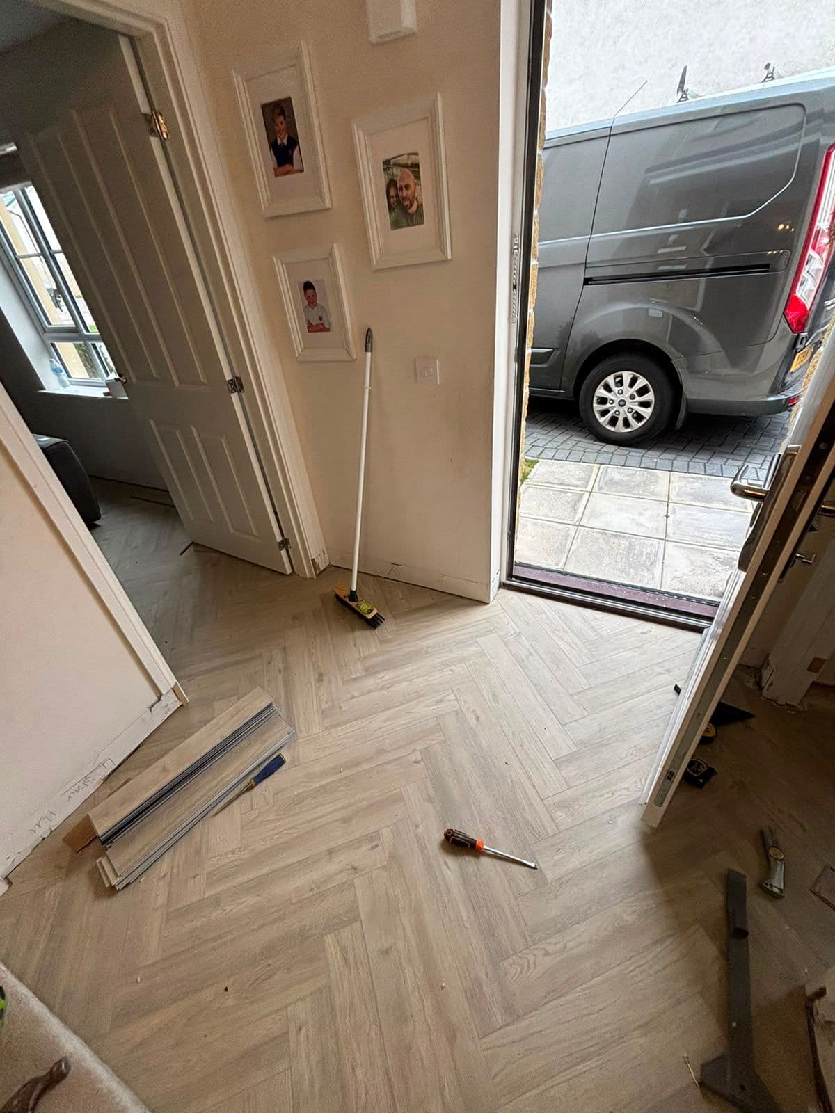 Herringbone flooring finished in a hallway entrance